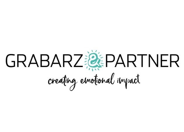 Logo von Grabarz & Partner mit dem Slogan 'creating emotional impact'